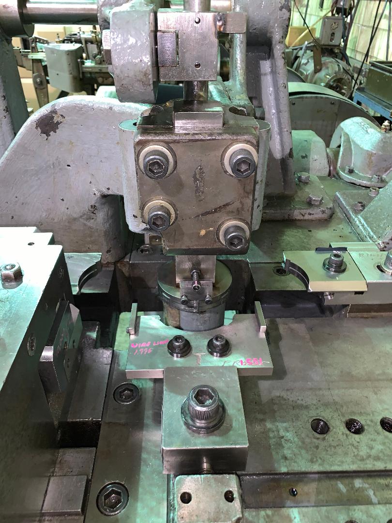 A machine is sitting on top of a table in a factory.