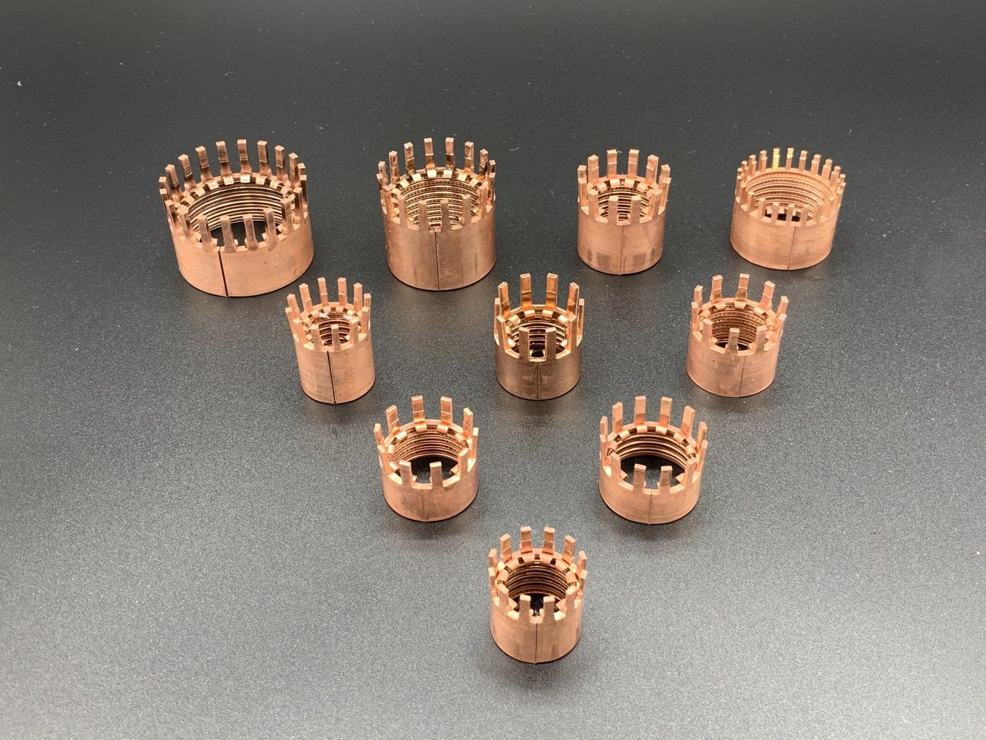 A group of copper rings are sitting on a table.