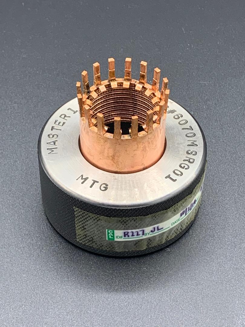 A close up of a metal object on a table.