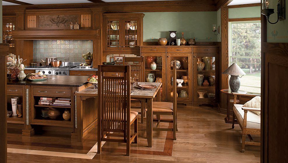 A kitchen with a table and chairs in it