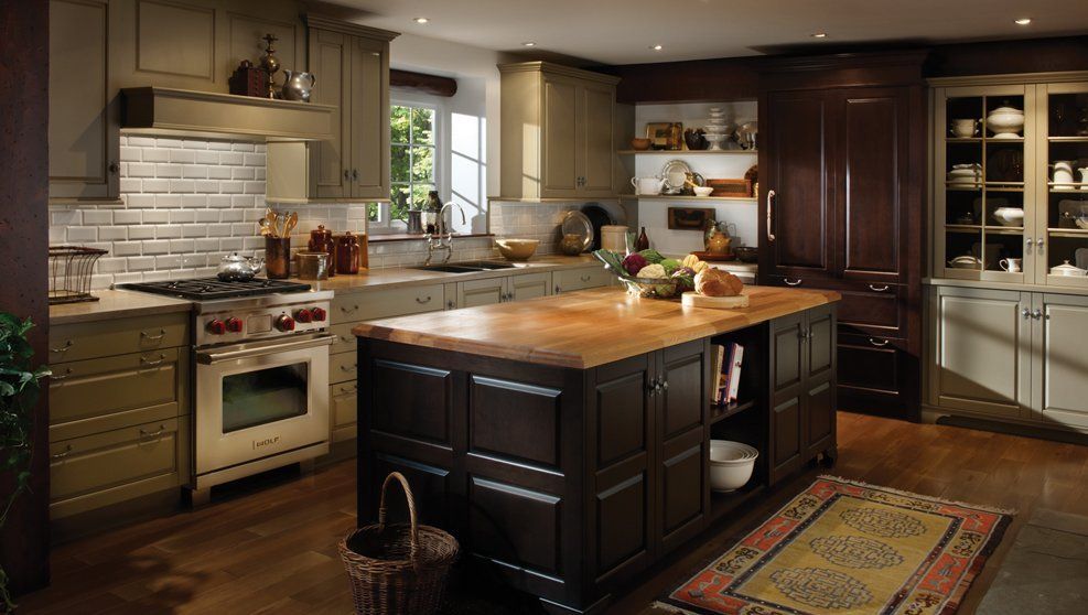 A kitchen with a large island in the middle