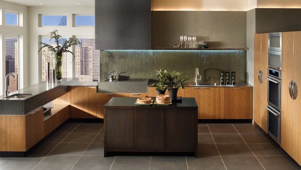 A kitchen with wooden cabinets and stainless steel appliances