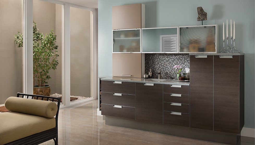 A living room with lots of cabinets and drawers