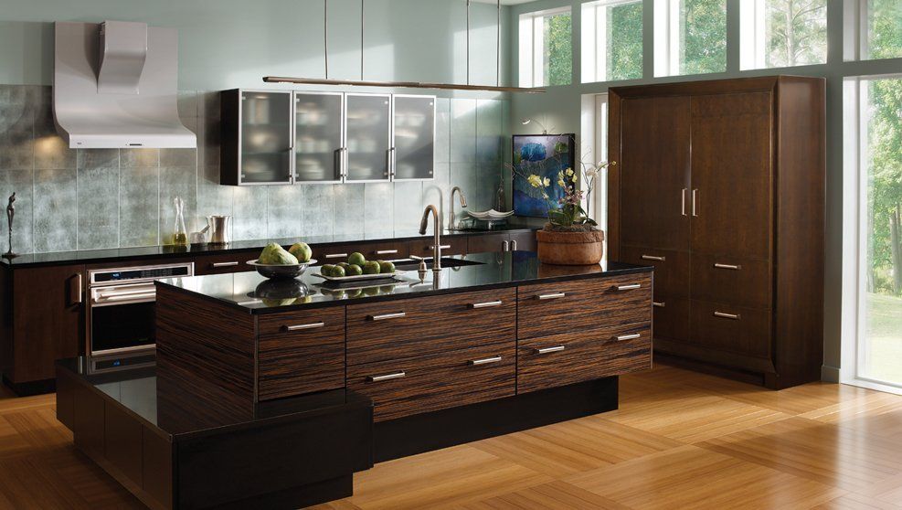 A kitchen with a large island in the middle