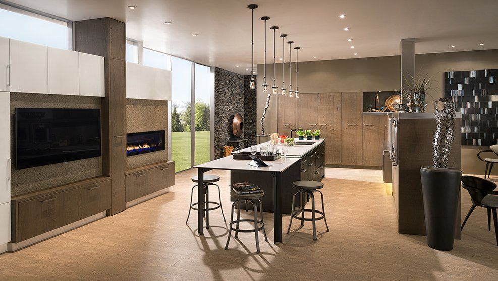 An artist 's impression of a modern kitchen with a large island and stools.