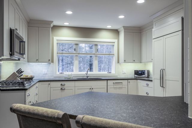 Contemporary Farmhouse Kitchen Remodel by Woodstock Kitchens & Baths project photo 2