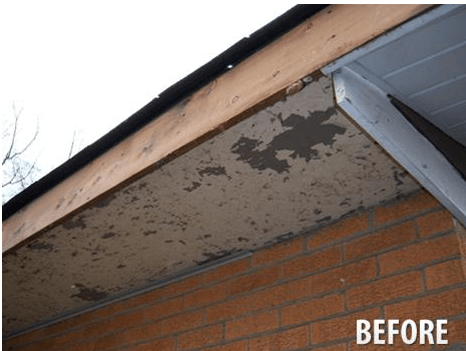 A before picture of a roof with a brick wall