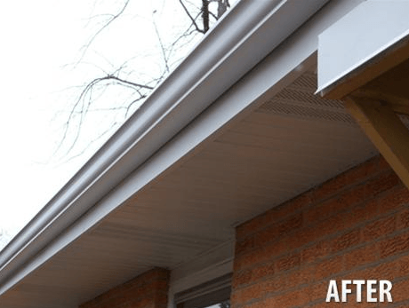 A picture of a gutter on a brick building with the caption after