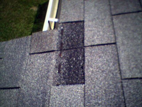 A close up of a roof with a hole in it