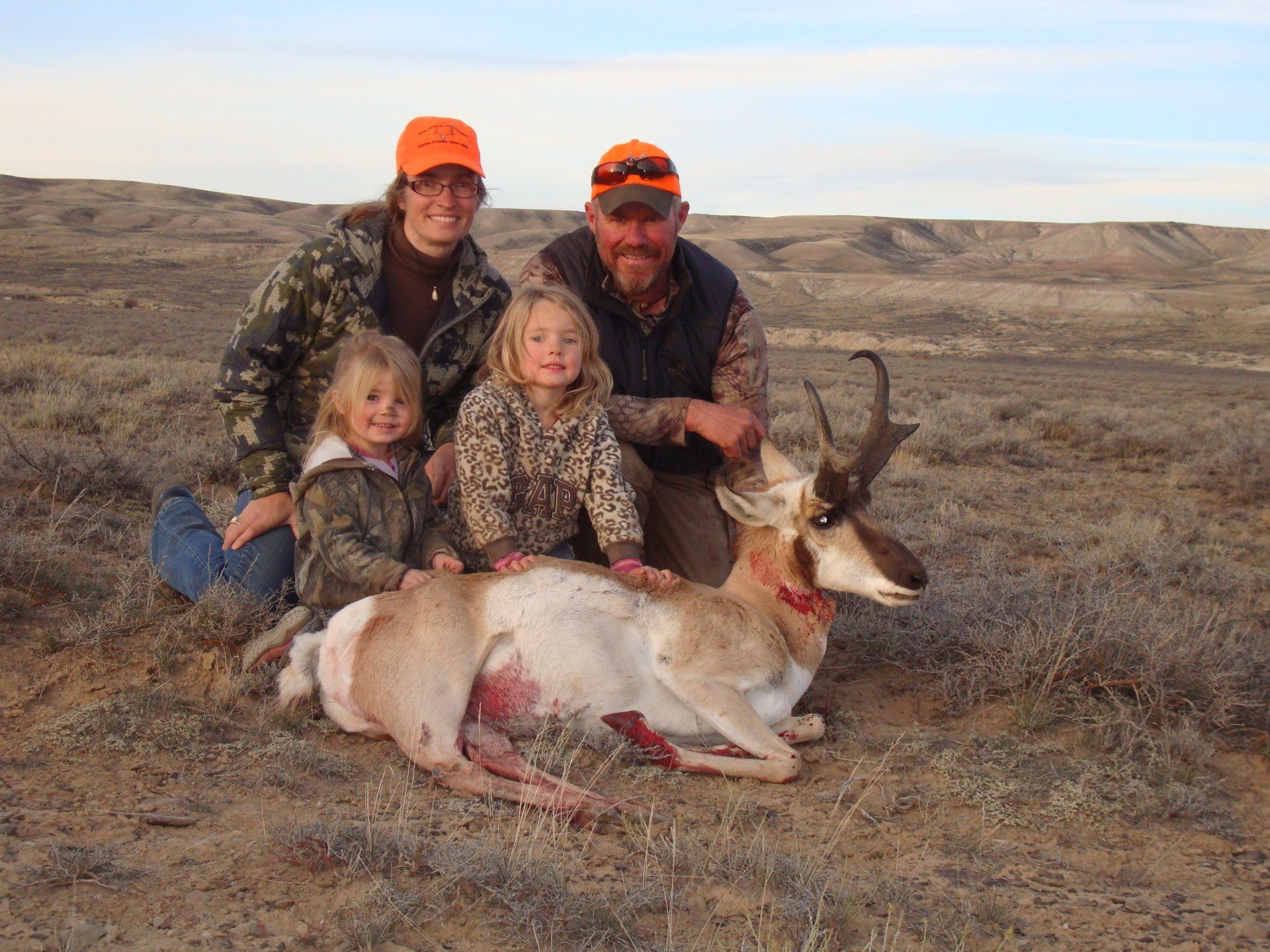 Wyoming desert setting; everyone wears camouflage and orange hats.