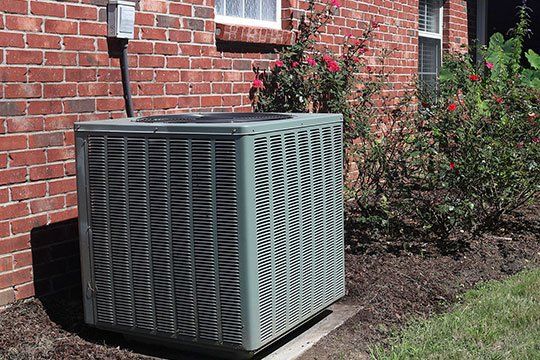 HVAC Unit Outside The House — Victoria, TX — AAA Air Conditioning, Inc. HVAC Unit Outside The House — Victoria, TX — AAA Air Conditioning, Inc.