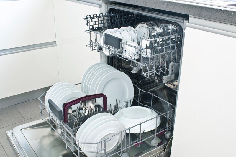 Open Dishwasher With Clean Dishes — De Soto, MO — Midwest Appliance Repair Heating & Cooling