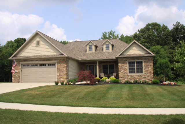 New Home Remodeling — Rustic House With Driveway And Front Yard In Orrville, OH