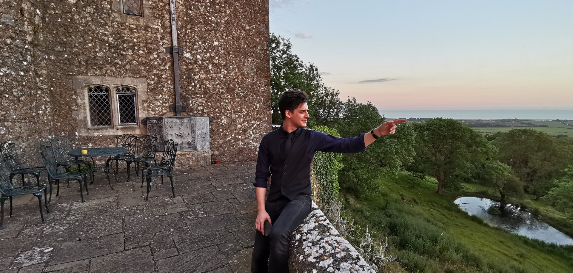Jack posing outside Lympne Castle in Kent for a wedding reception Kent Wedding Reception