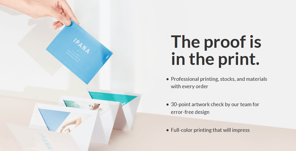 A person is holding a piece of paper that says `` the proof is in the print ''.