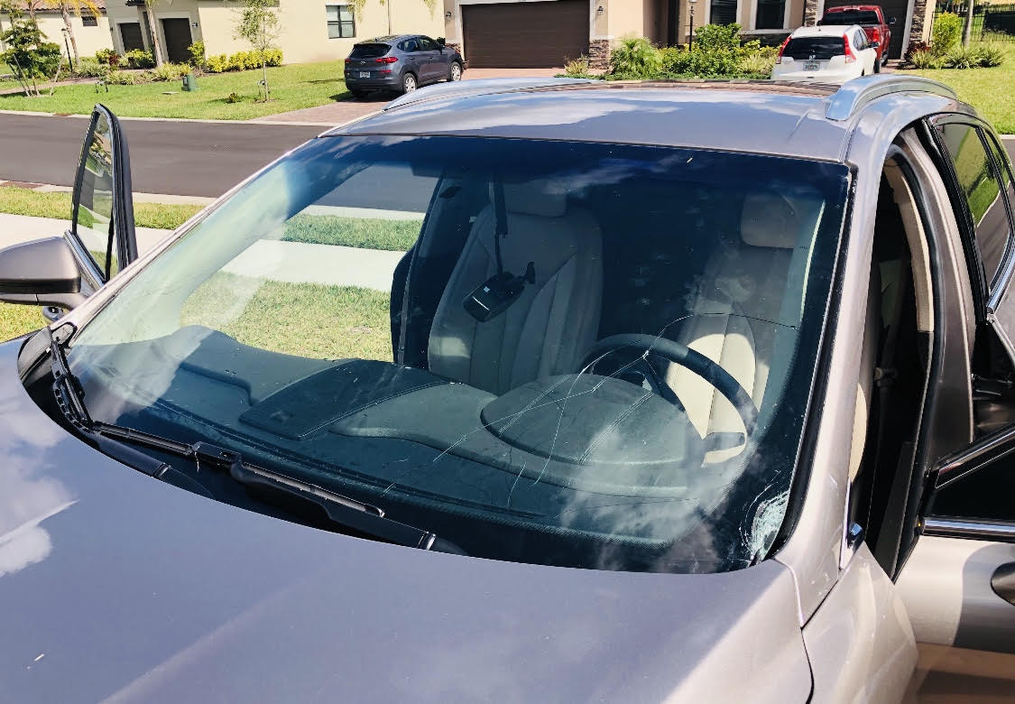 Cracked windshield in need of windshield replacement services