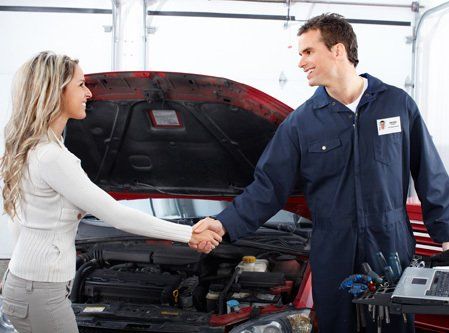 Client thanking mechanic after motor repair and service