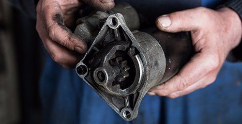 View of the professional repairing the automobile part