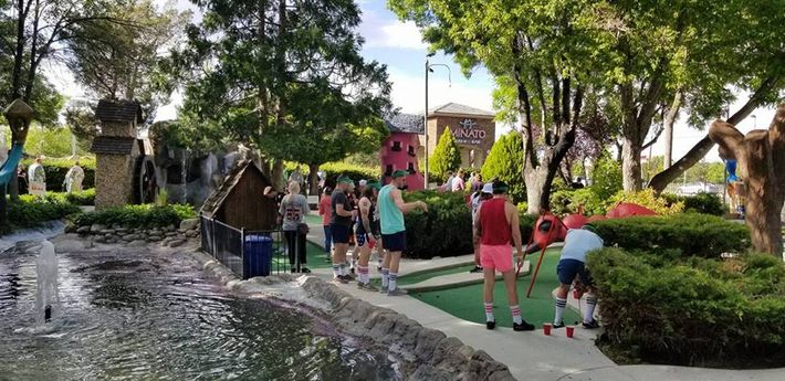 Mini Golf in NV — Playing Golf Beside Pond in Reno, NV Mini Golf in NV — Playing Golf Beside Pond in Reno, NV