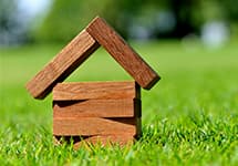 Wooden house representing a property investment