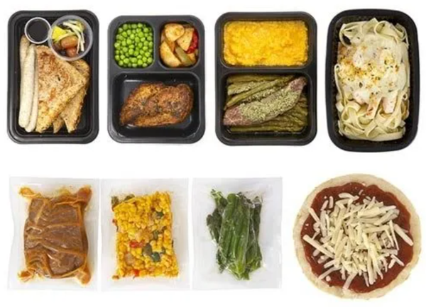 A variety of food in plastic containers including a pizza