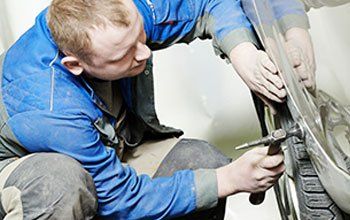 car wheel being fitted