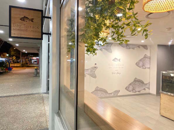 Green Signage Under The Roof — Signage In Acacia Ridge, QLD Lighting Installation — Signage In Acacia Ridge, QLD