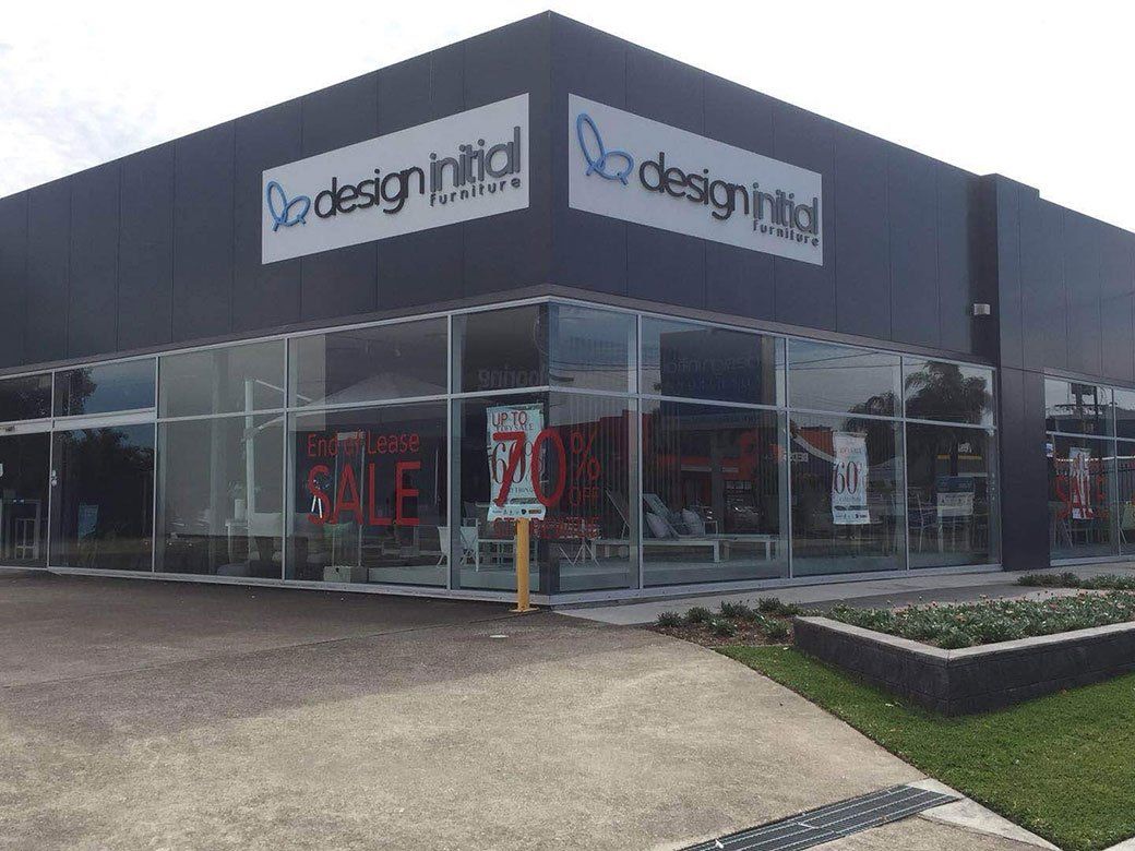 Design Initial Sign On A White Background — Signage In Acacia Ridge, QLD