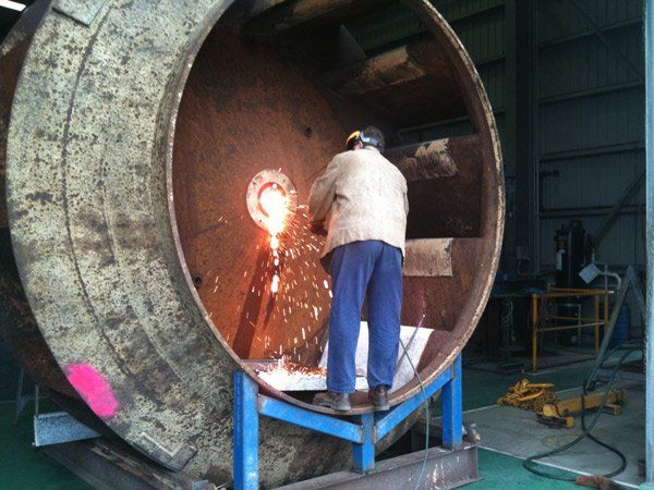 side view of man welding