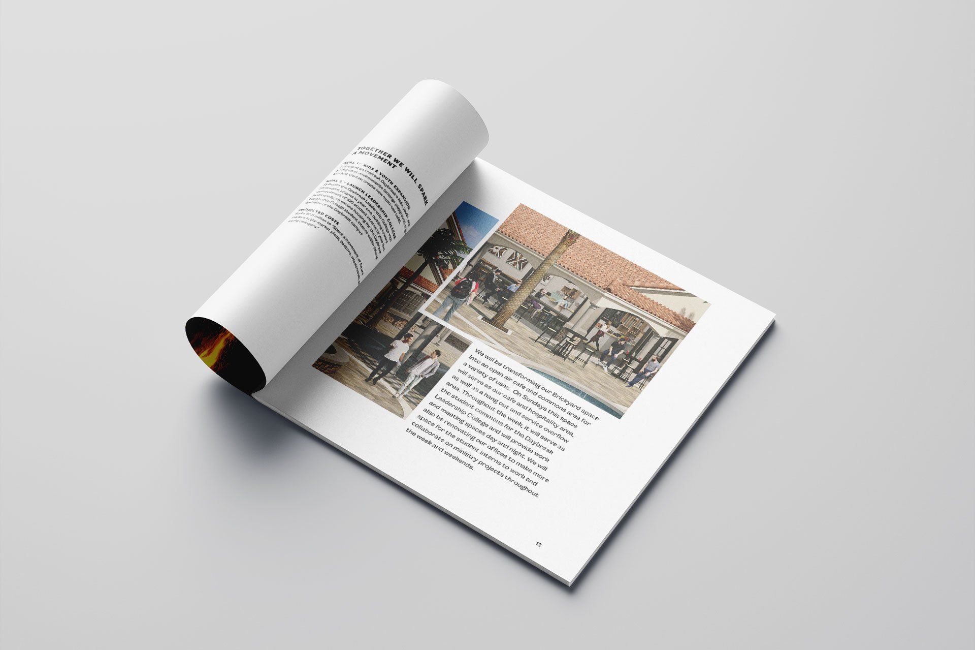 A magazine is open to a page with a picture of a building on it.