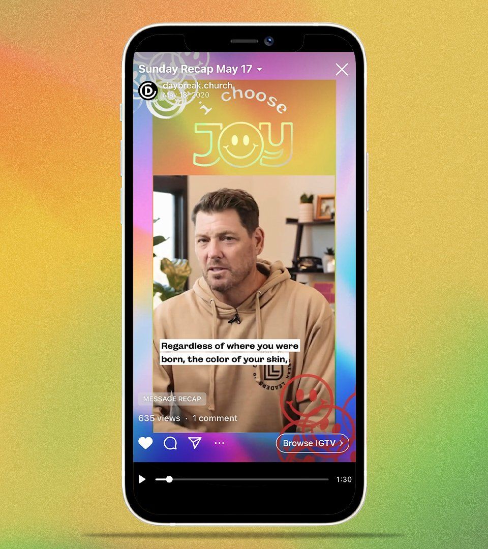 A man in a hoodie is on the screen of a cell phone.