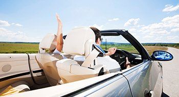 Beautiful couple during road trip on a sunny day.