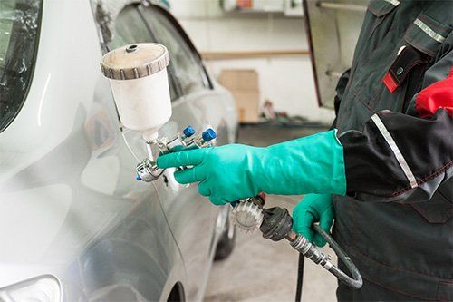 Spraying Paint On A Car