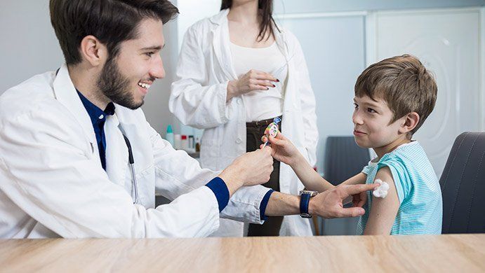 Doctor with a Kid — Hampstead, NC — Hampstead Medical Center PC Doctor with a Kid — Hampstead, NC — Hampstead Medical Center PC
