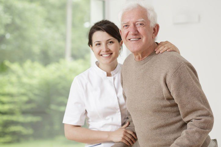 Senior and her nurse smiling - law office in Staten Island, NY