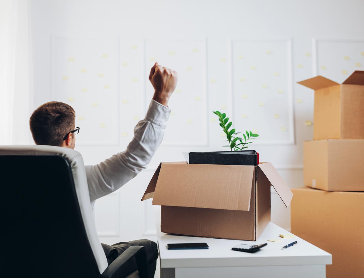 Businessman moving into a new office — Newport News, VA — Reliance Moving and Storage Businessman moving into a new office — Newport News, VA — Reliance Moving and Storage