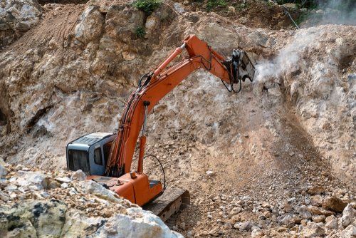 earth moving machine excavating soil