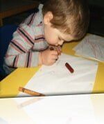 Little Boy Writing — Child learning center in Loomis, CA Little Boy Writing — Child learning center in Loomis, CA