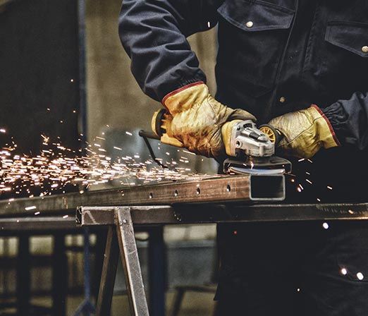 Worker Using a Grinder — Merrillville, IN — Northwest Indiana Fabrication LLC