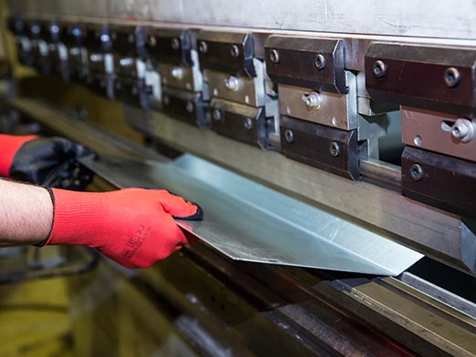 Man Working on a Press Machine — Merrillville, IN — Northwest Indiana Fabrication LLC