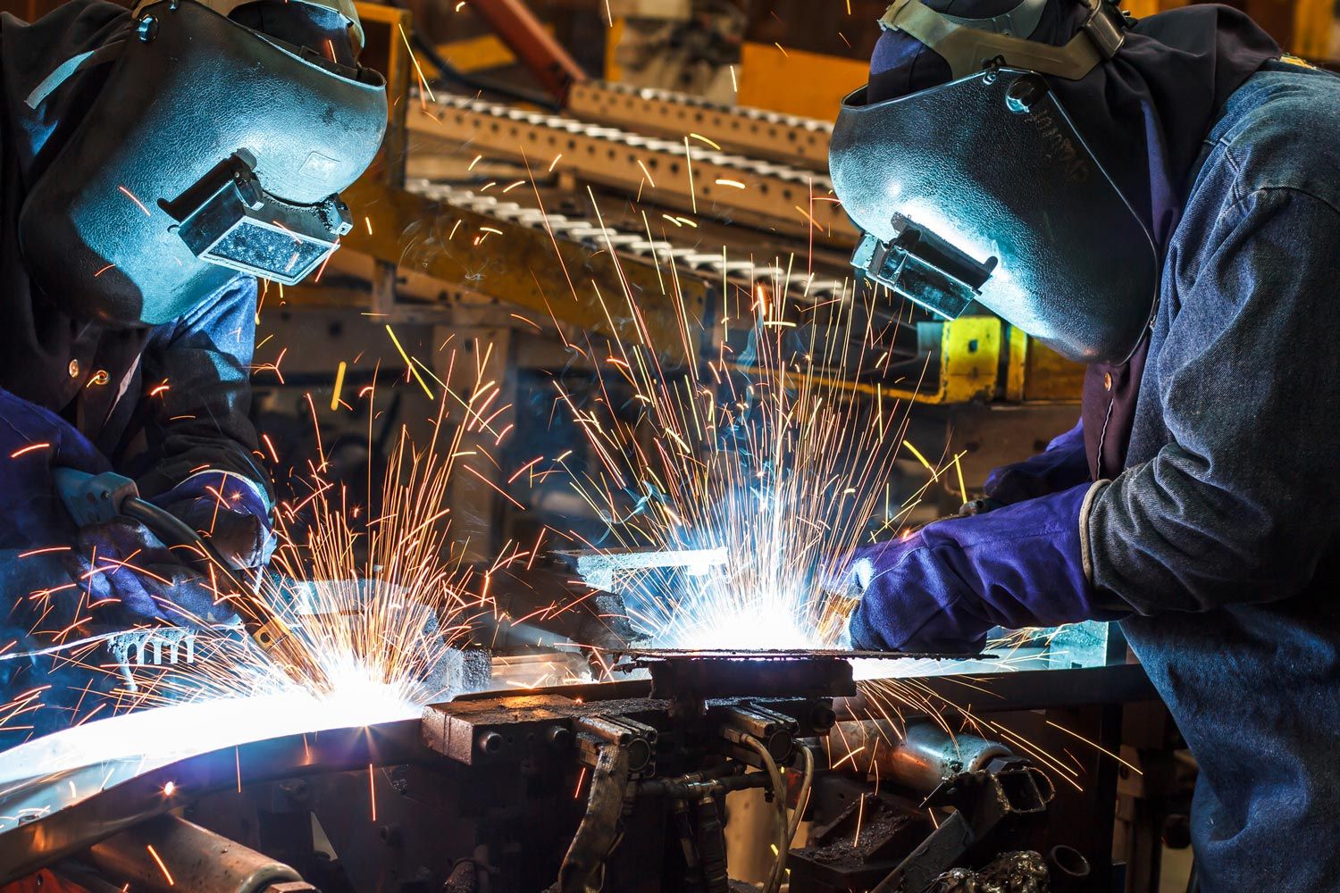 Two Welders Welding Metal Sheets — Merrillville, IN — Northwest Indiana Fabrication LLC