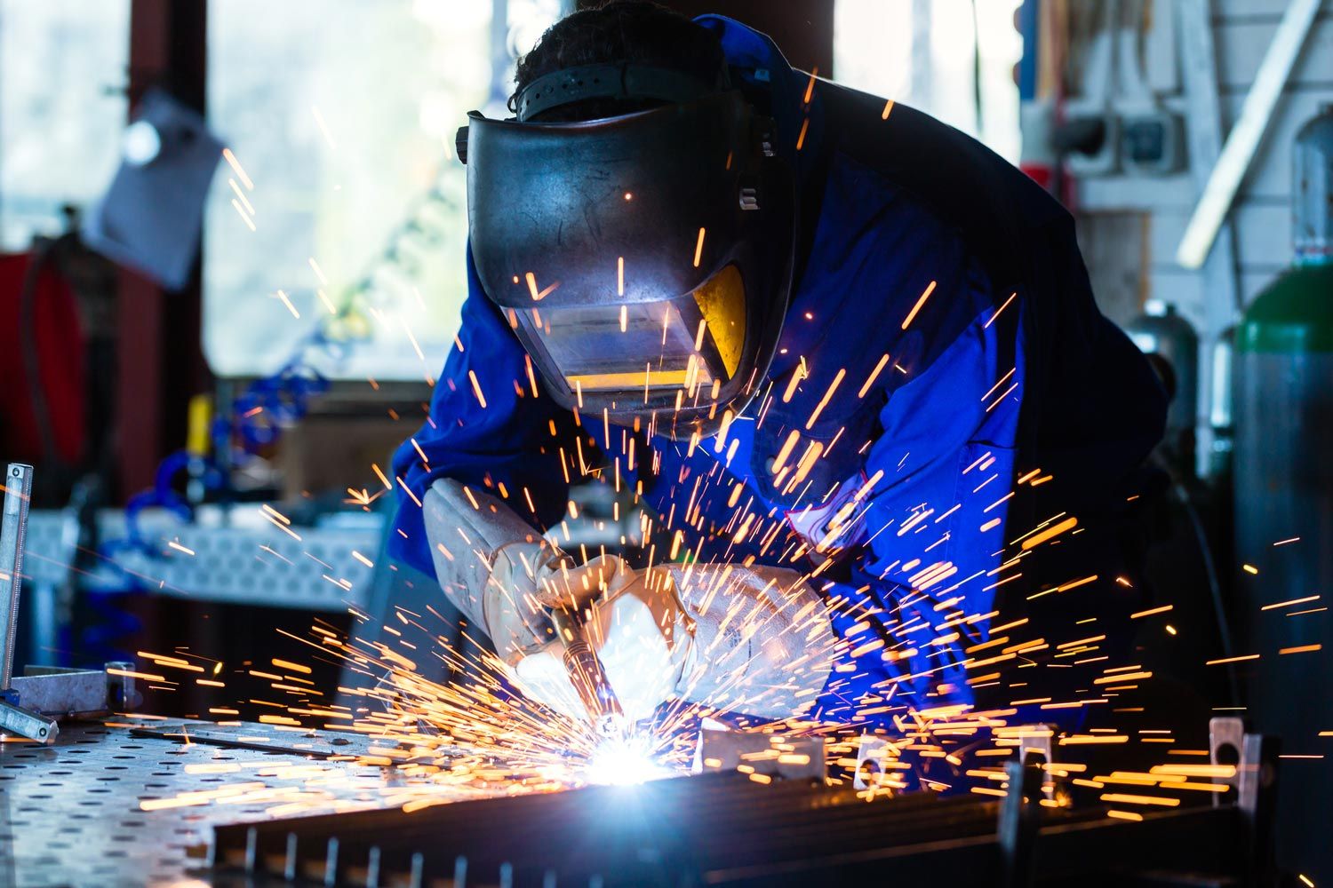 Welder Welding Metal Sheets — Merrillville, IN — Northwest Indiana Fabrication LLC