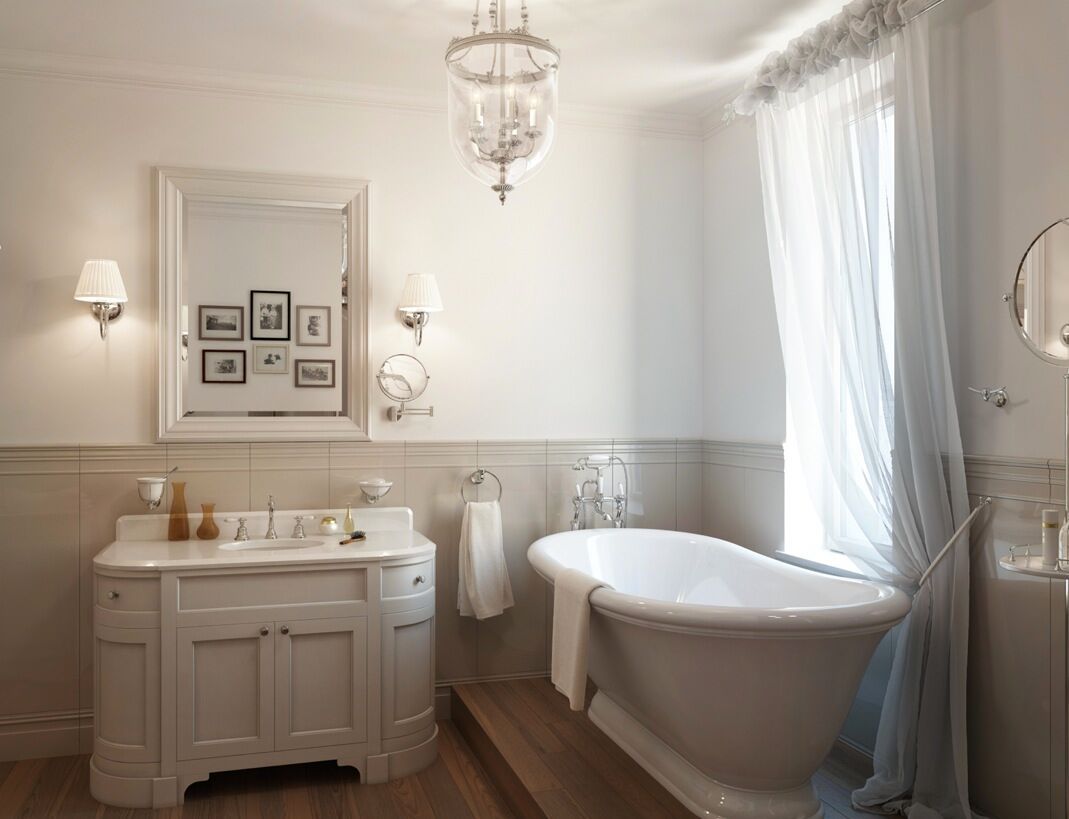 Elegant white bathroom with a clawfoot tub, vanity, and sheer curtains.