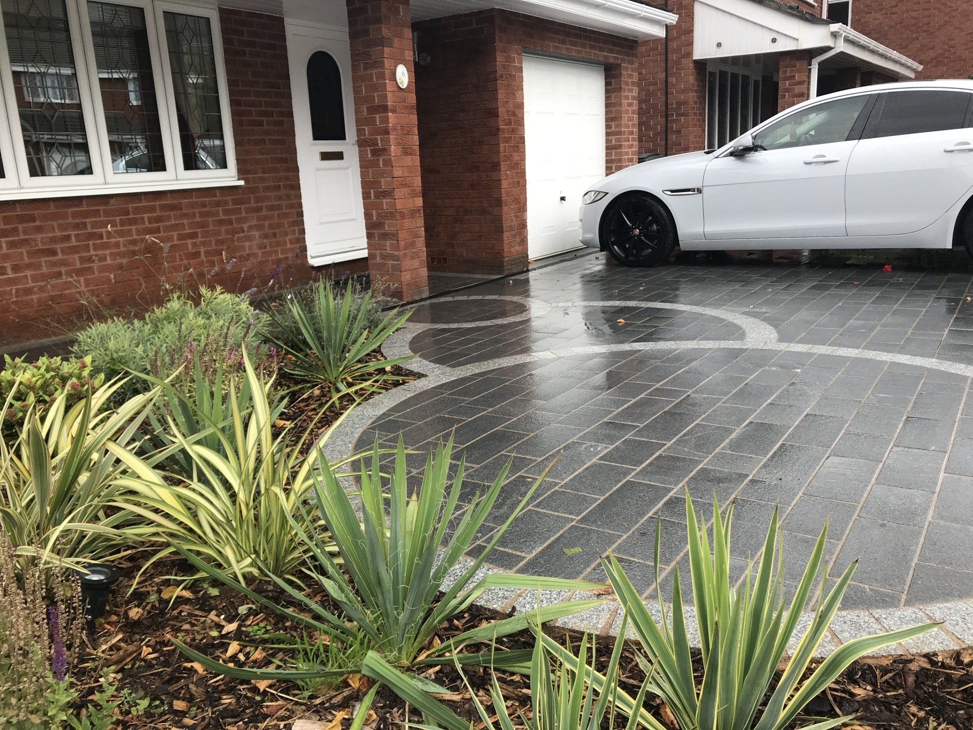 A grey circular design Driveway