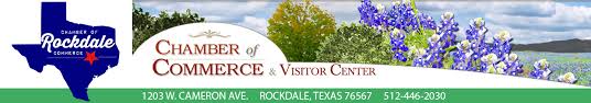 Roachdale Chamber of Commerce banner with blue logo, flowers, and contact information across a green strip