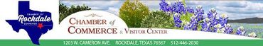 Roachdale Chamber of Commerce banner with blue logo, flowers, and contact information across a green strip