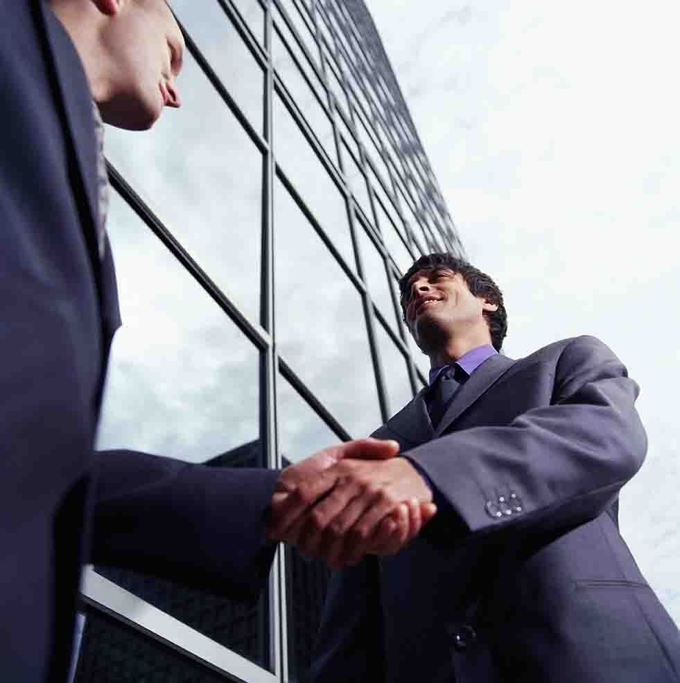 Business Man Shaking Hands — Lumberton, NC — Realty One Group Heritage