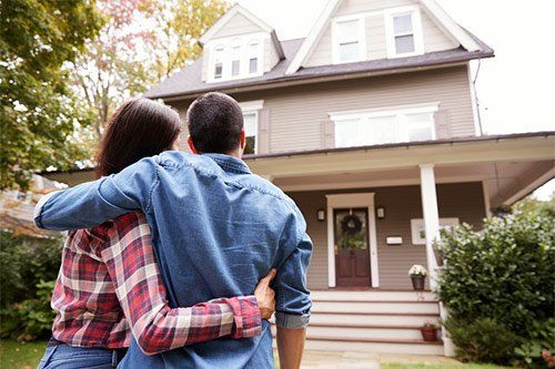 Couple Looking At Their New House — Lumberton, NC — Realty One Group Heritage