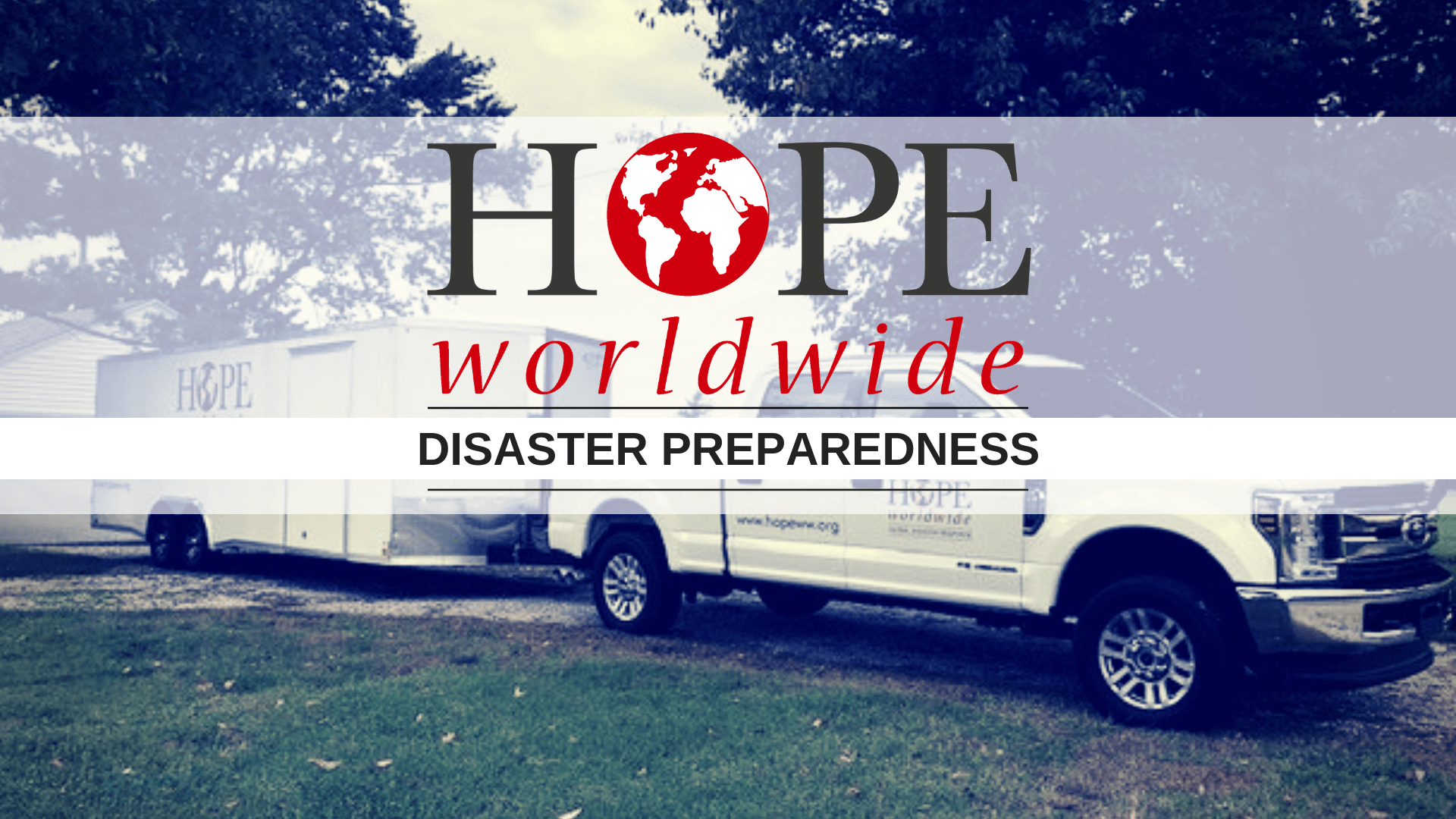 HOPE Worldwide disaster preparedness banner over a white emergency vehicle