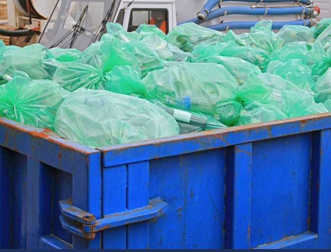 roll off dumpster full of trash from an office building
